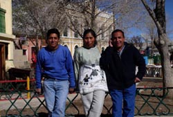 Jose, Wilma´s driver, Wilma, and Noverto, her friend, outside her restaurant