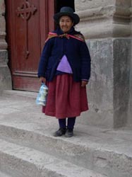 An old lady by the cathedral in Puqio