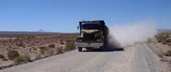 Outside of Uyuni, truck spews a dust storm in its wake